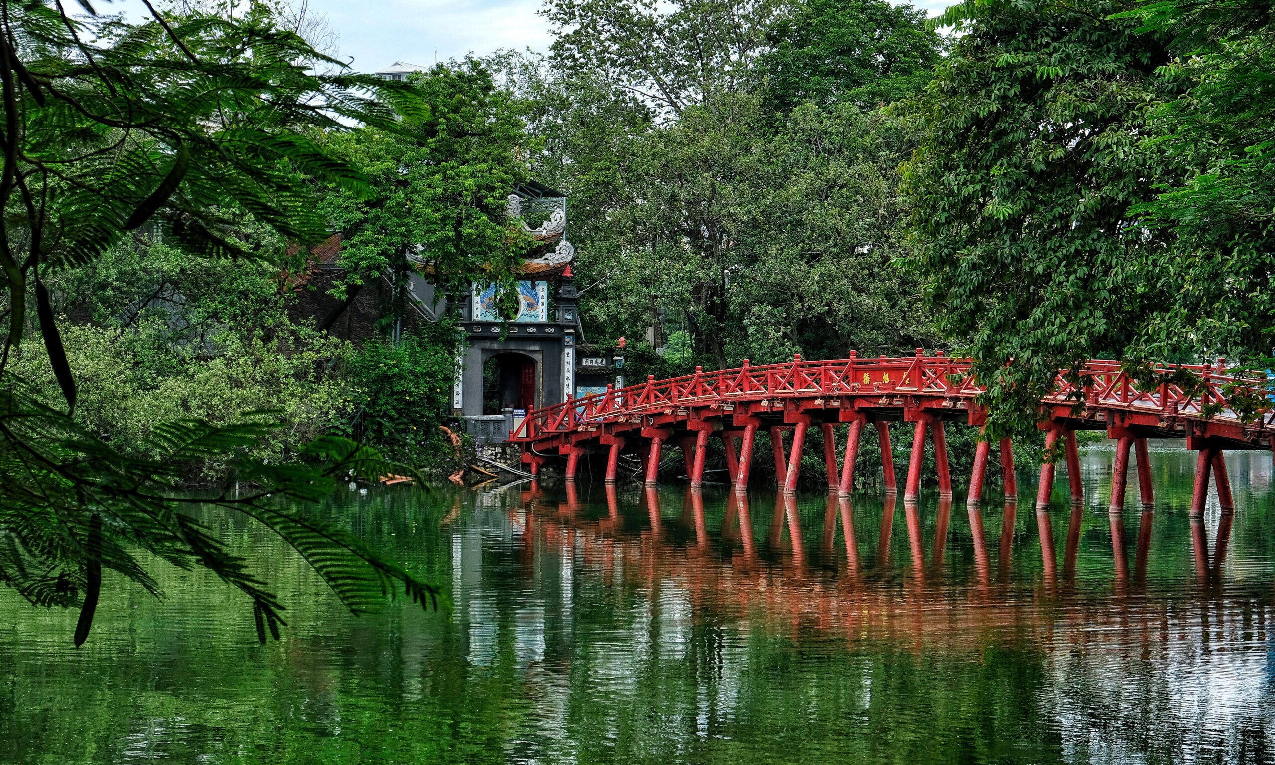 water view of Huc Bridge in the Ngoc Son Temple