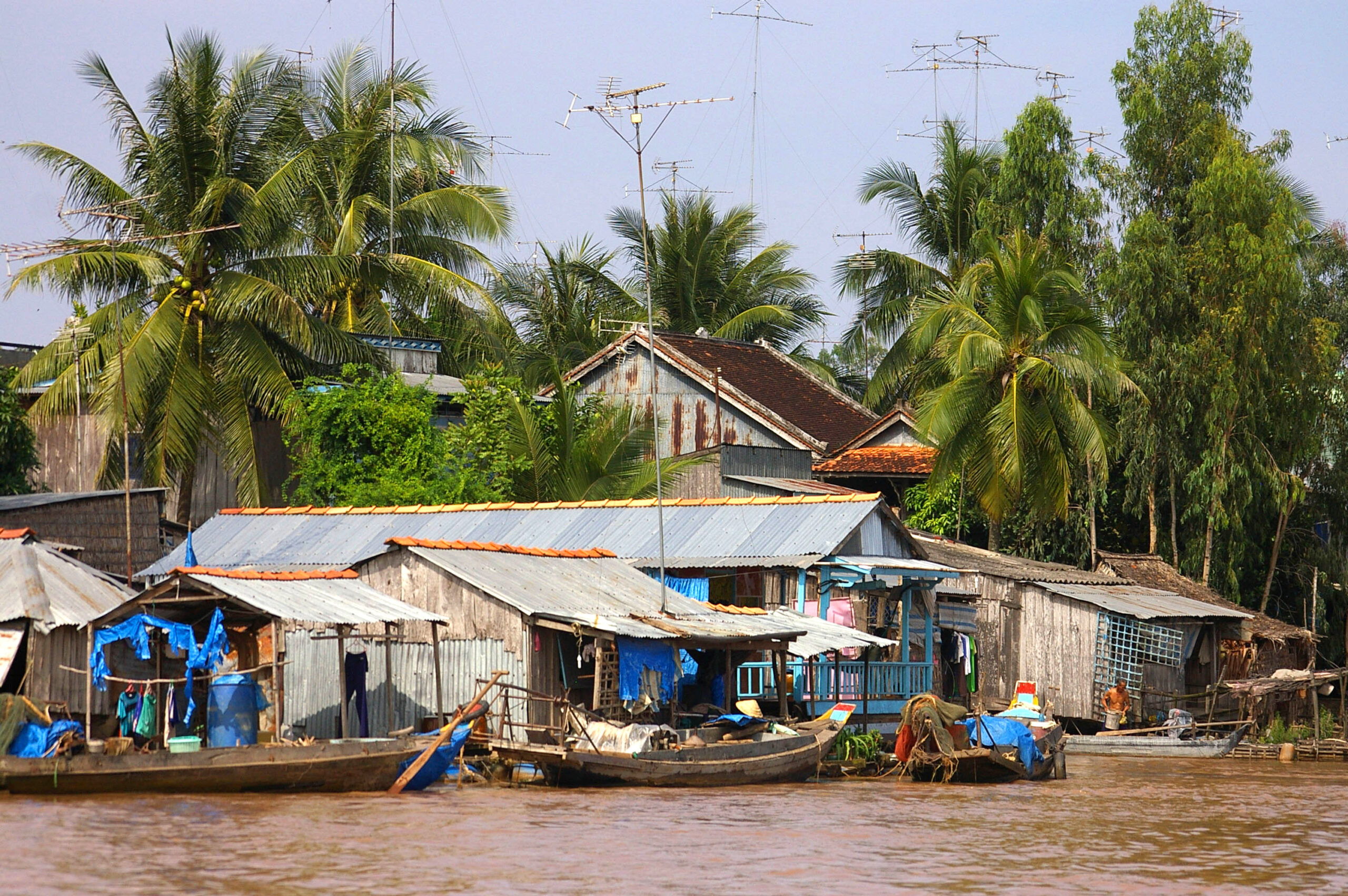 village and boats near the riverfront of Mekong Delta, Vietnam
