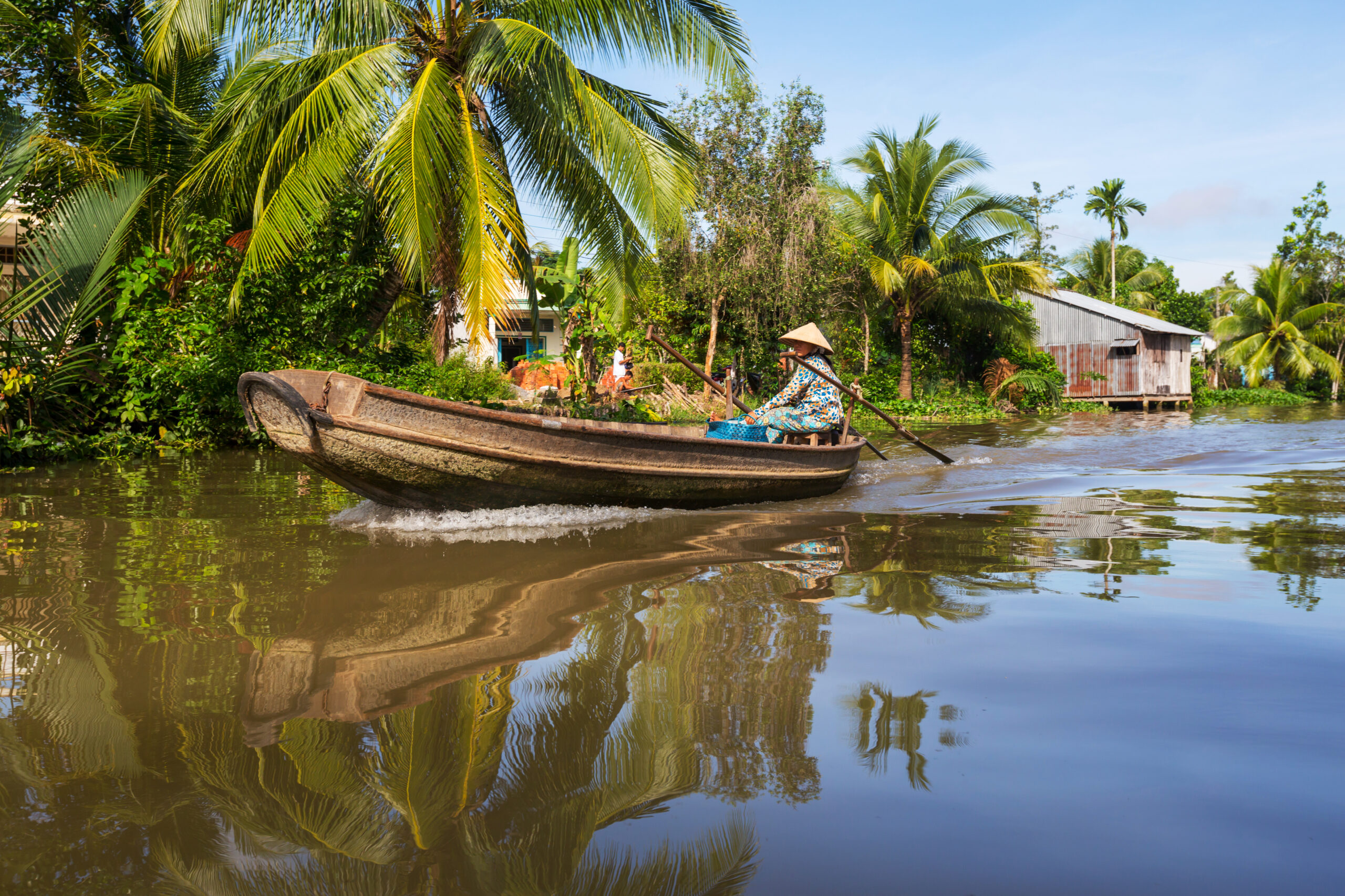 woman riding a boat at Mekong Delta
