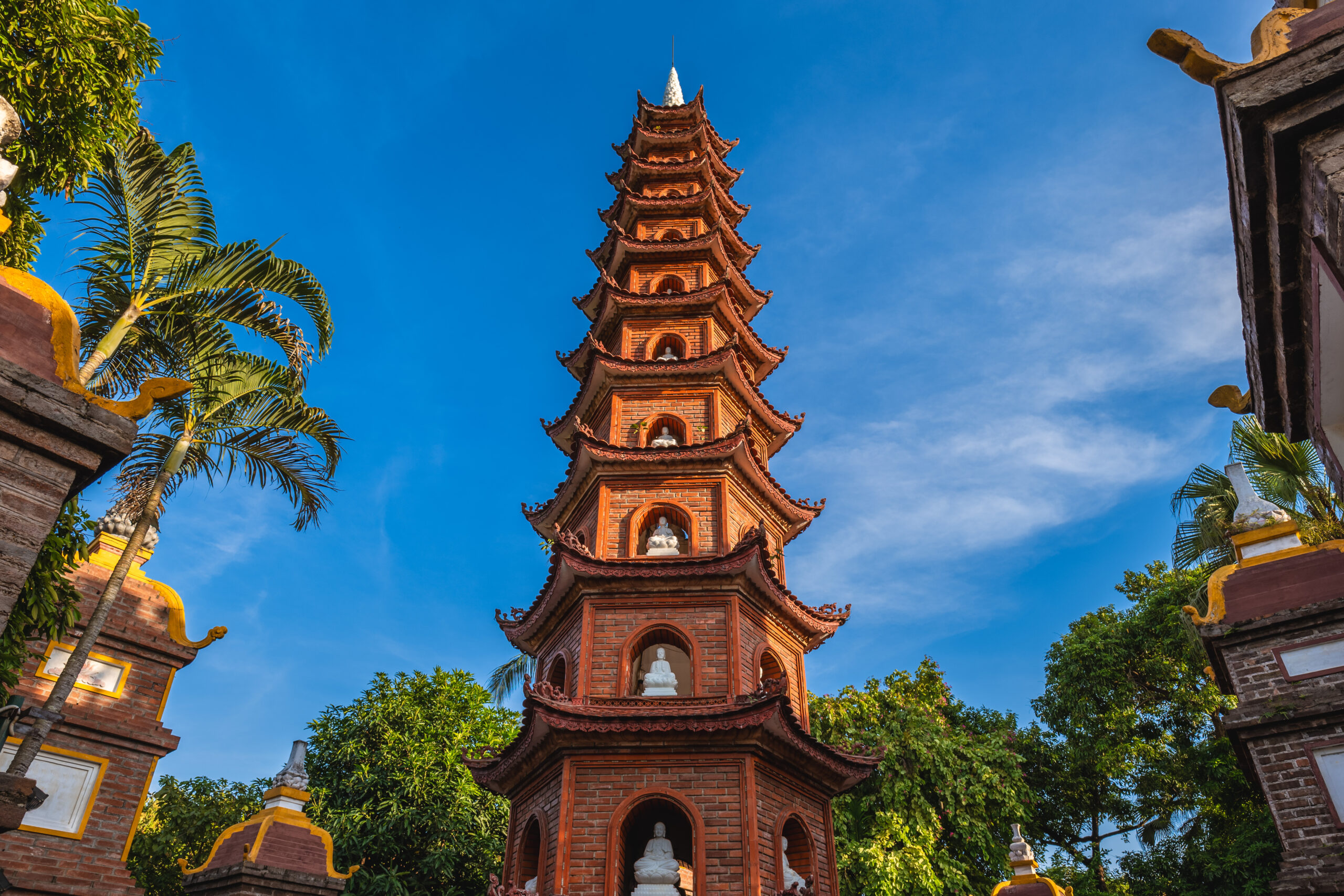 view of Tran Quoc Pagoda from ground view looking up towards sky 