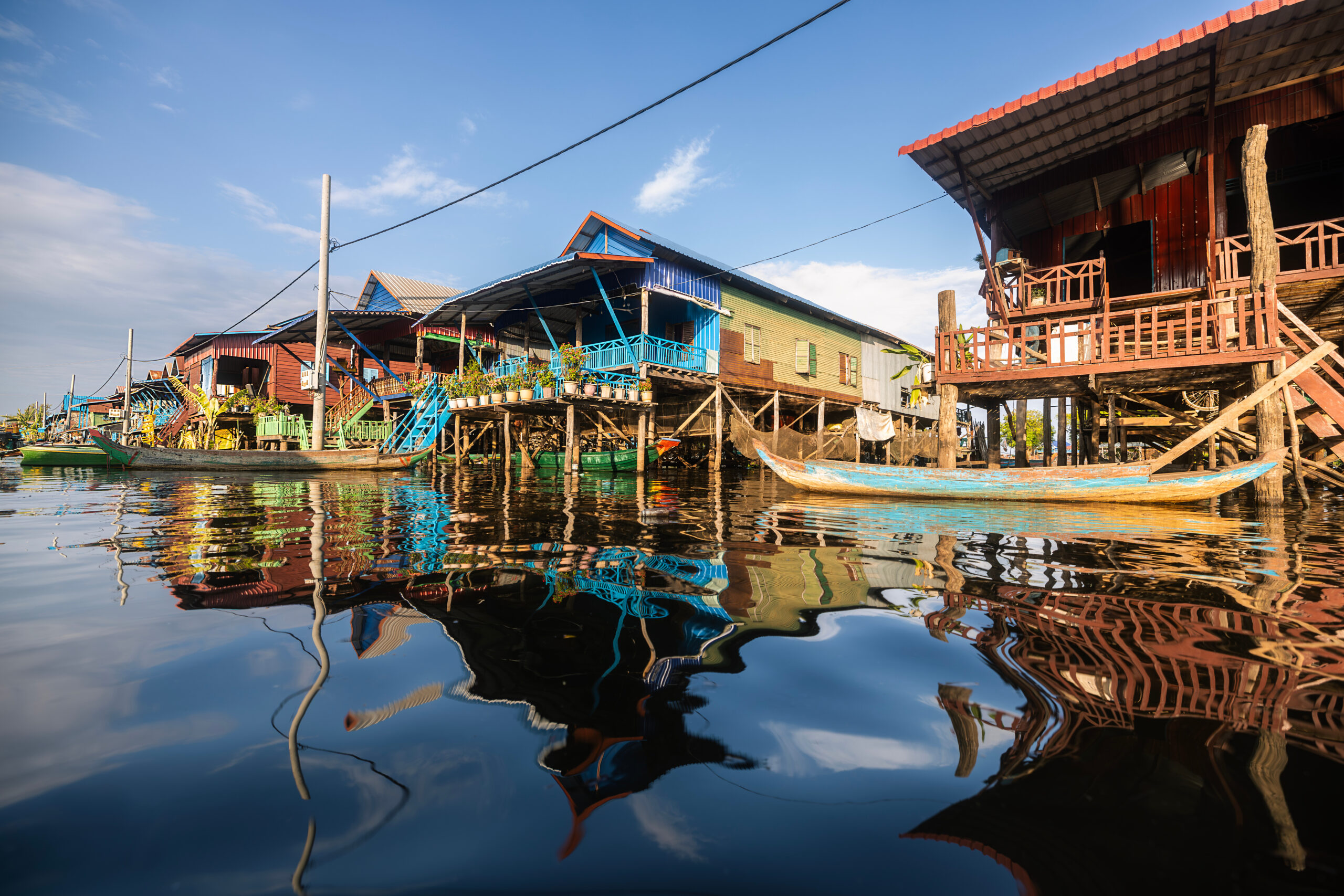 Kampong Phluk floating village with stilt houses on Tonle Sap lake in Cambodia