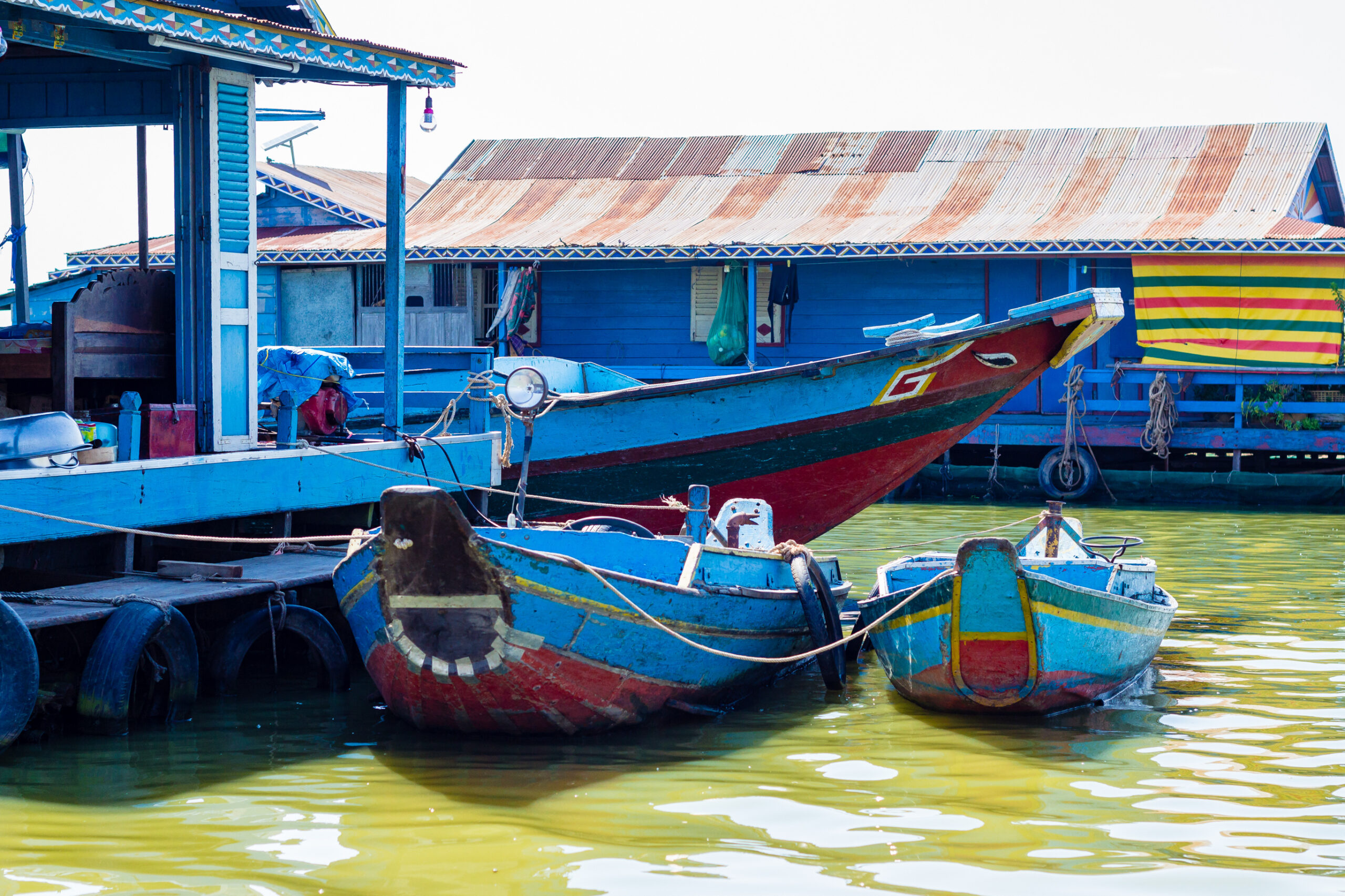 partial view of a boat home with boats attached to them at Kampong Luong