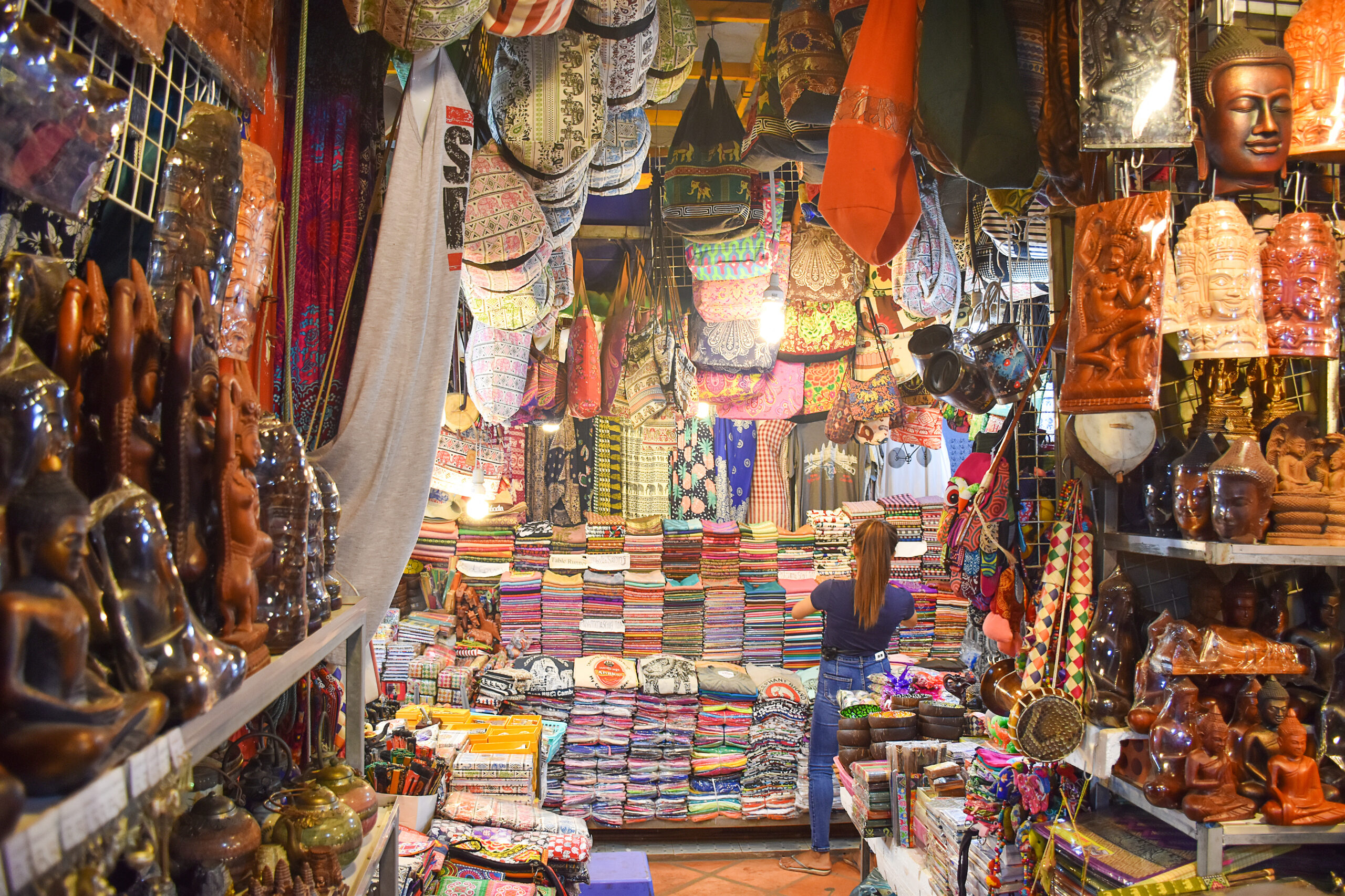 crowded stalls of vendors selling souvenirs in Siem Reap, Cambodia
