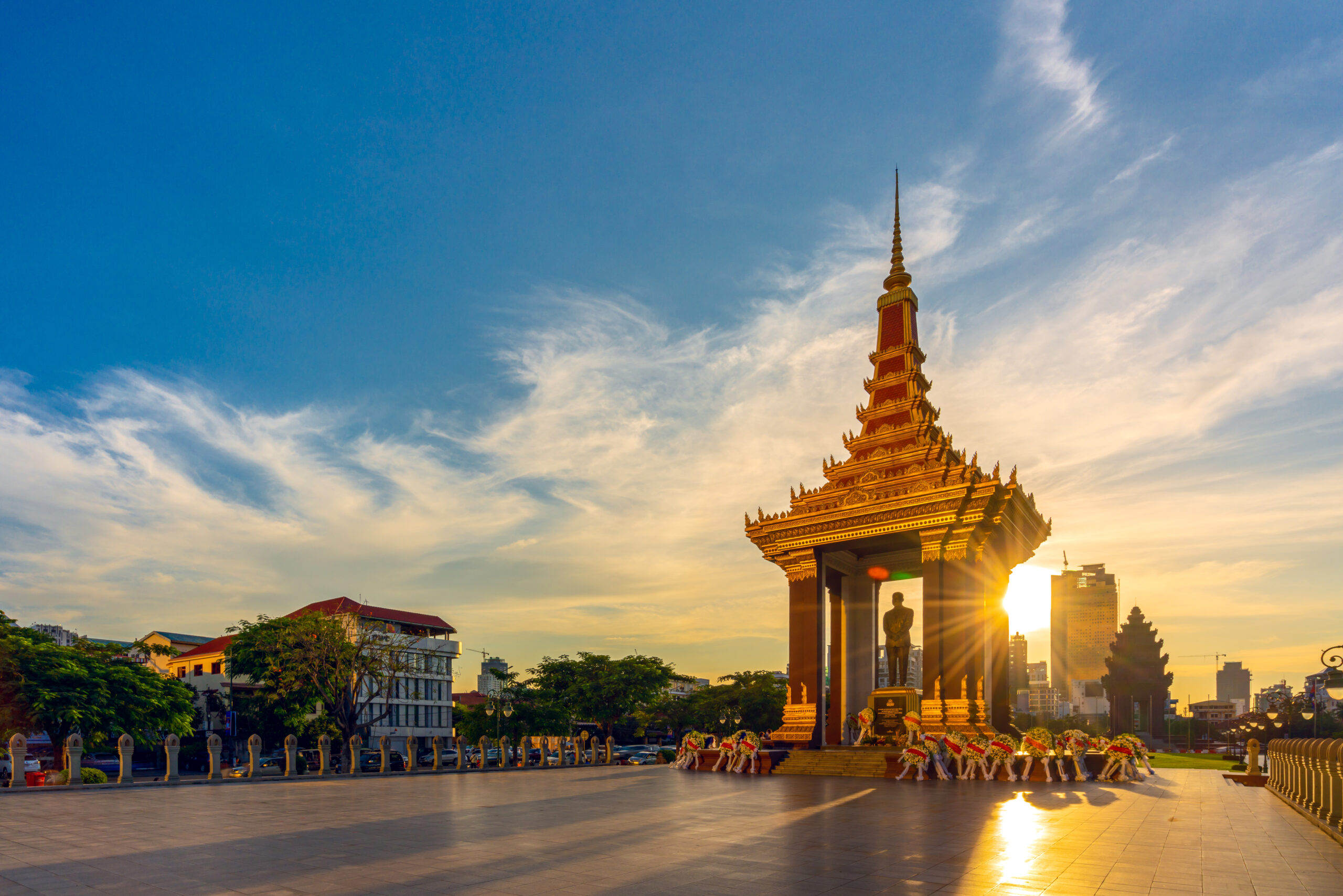 panorama view of Statue of King Father Norodom Sihanouk glowing during sunset