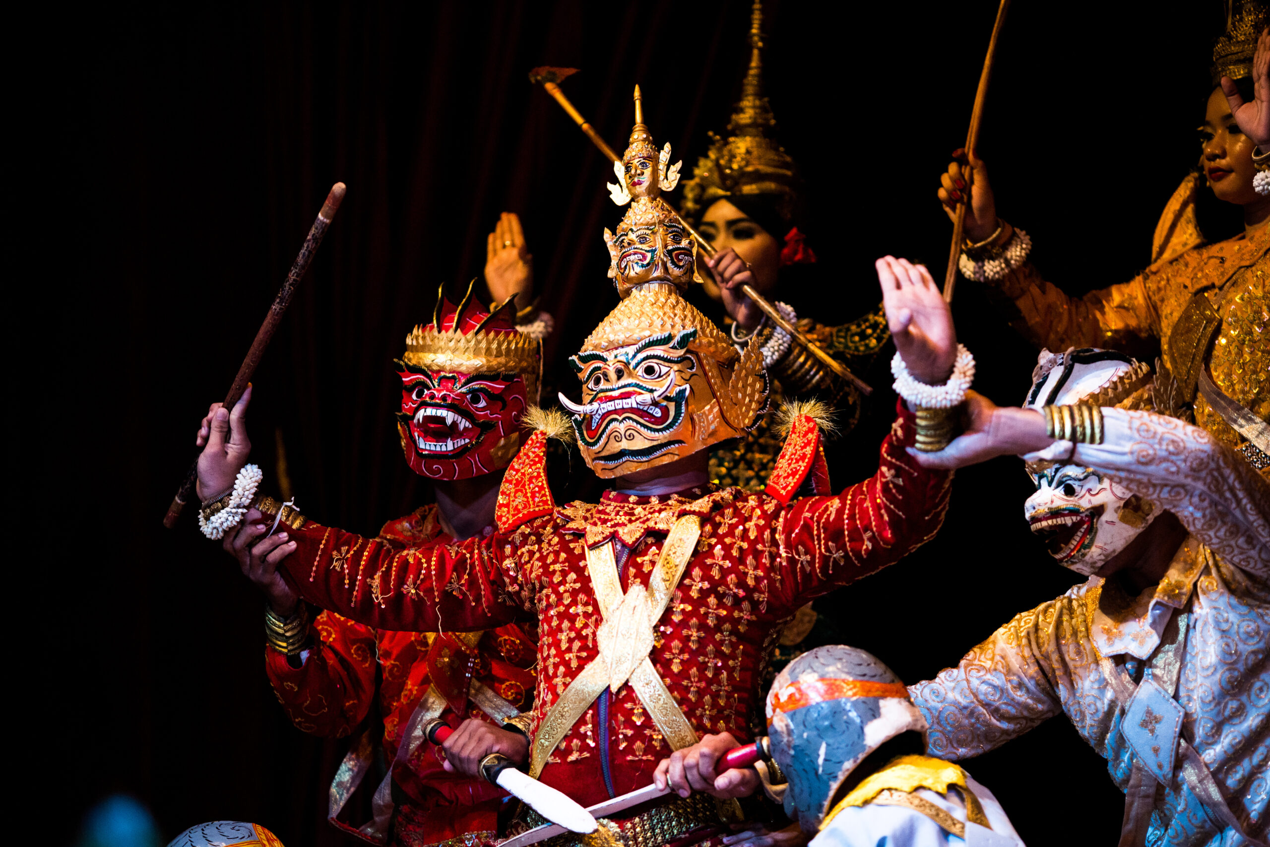 theatrical showing in Cambodia where actors wear masks reenacting a fight scene