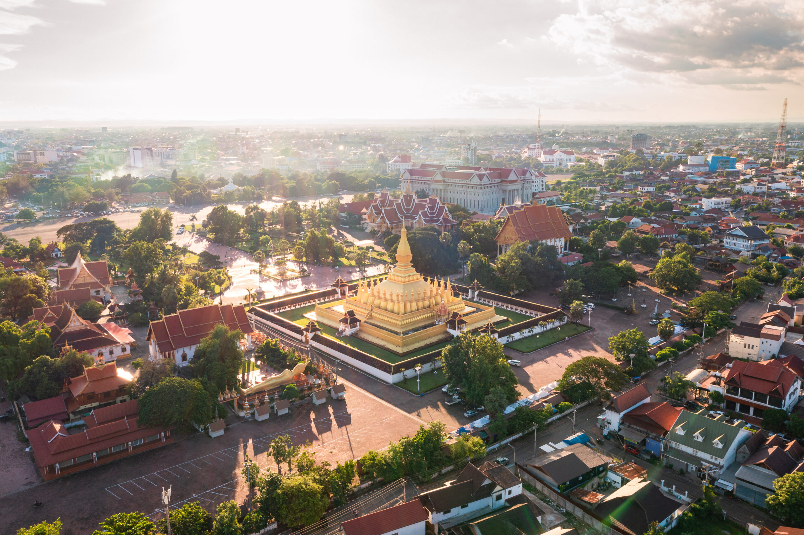 aerial view of Wat Thatluang Gold Stupa and surrounding buildings in Vientiane, laos