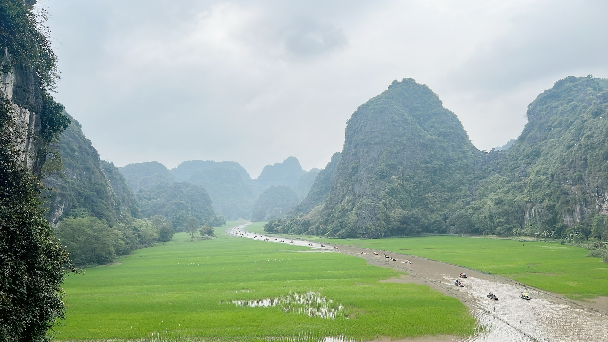 3A99D905-FA14-400B-9CC7-FDF07F3E40E1 Ninh Binh Vietnam limestone karsts rice fields and river landscapes