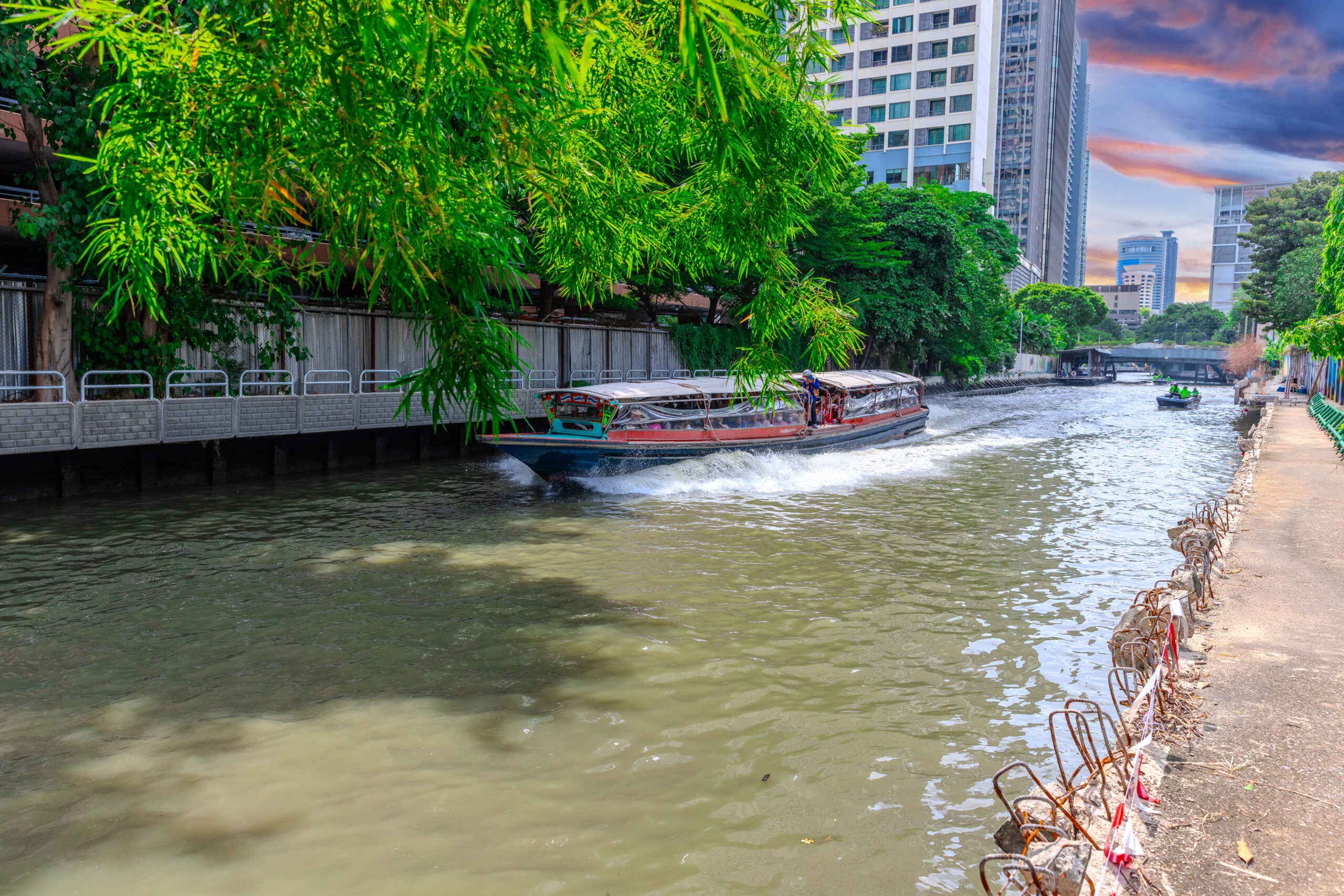 Ferry boat going through a Canal Khlong in Thai running from Soi 15 Sukhumvit Rd NANA to Soi 21 Sukhumvit Rd Asoke in BKK Bangkok, Thailand