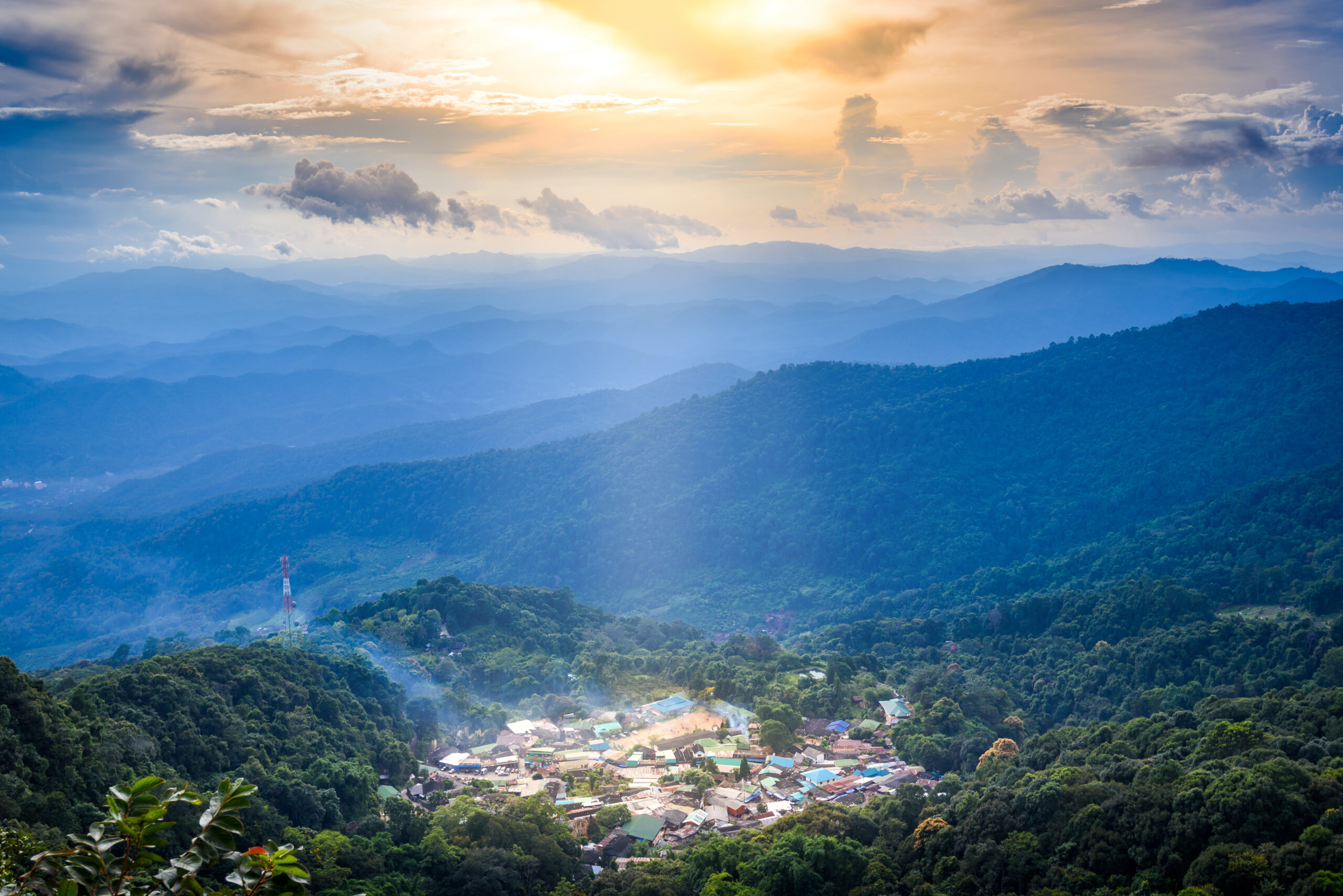 Top landscape View of mountain village on Doi Pui Mountains in sunset sky and clouds in Chiangmai , Thailand